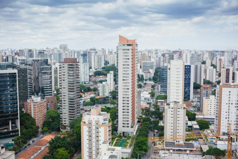High-rise buildings dominate the vibrant São Paulo skyline on a cloudy day.